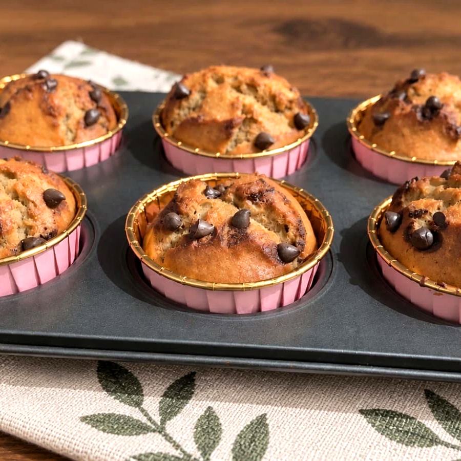 Whole wheat banana chocolate chip walnut muffins in a baking tray